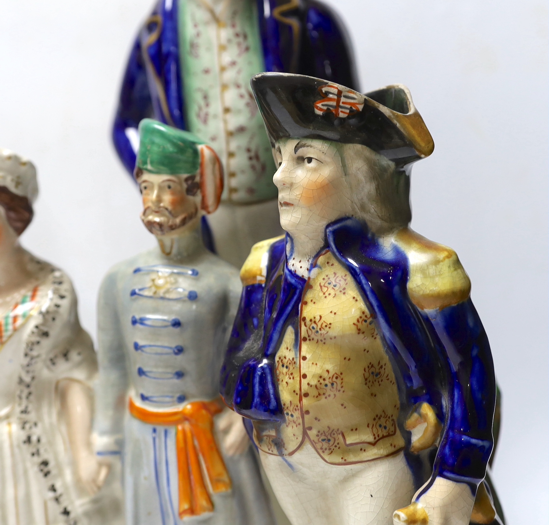 Military and Political Staffordshire figures - A Crimean war group of France, England and Turkey, a figure of Wellington as Prime Minister, a figure of Gladstone, a Nelson Toby jug and a General Hill/Marquis Wellington c